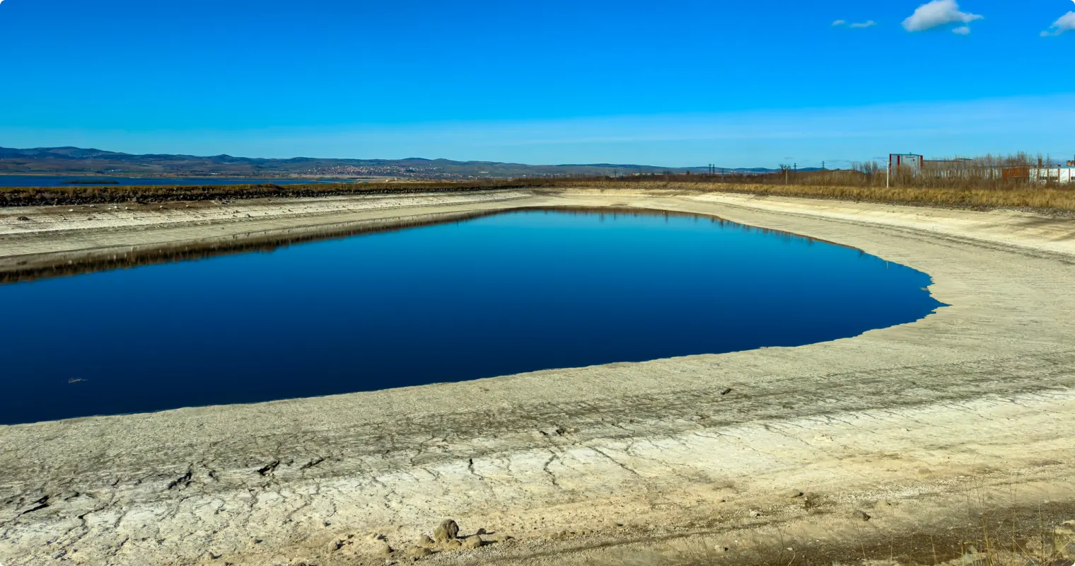 Lined evaporation pond holding brine